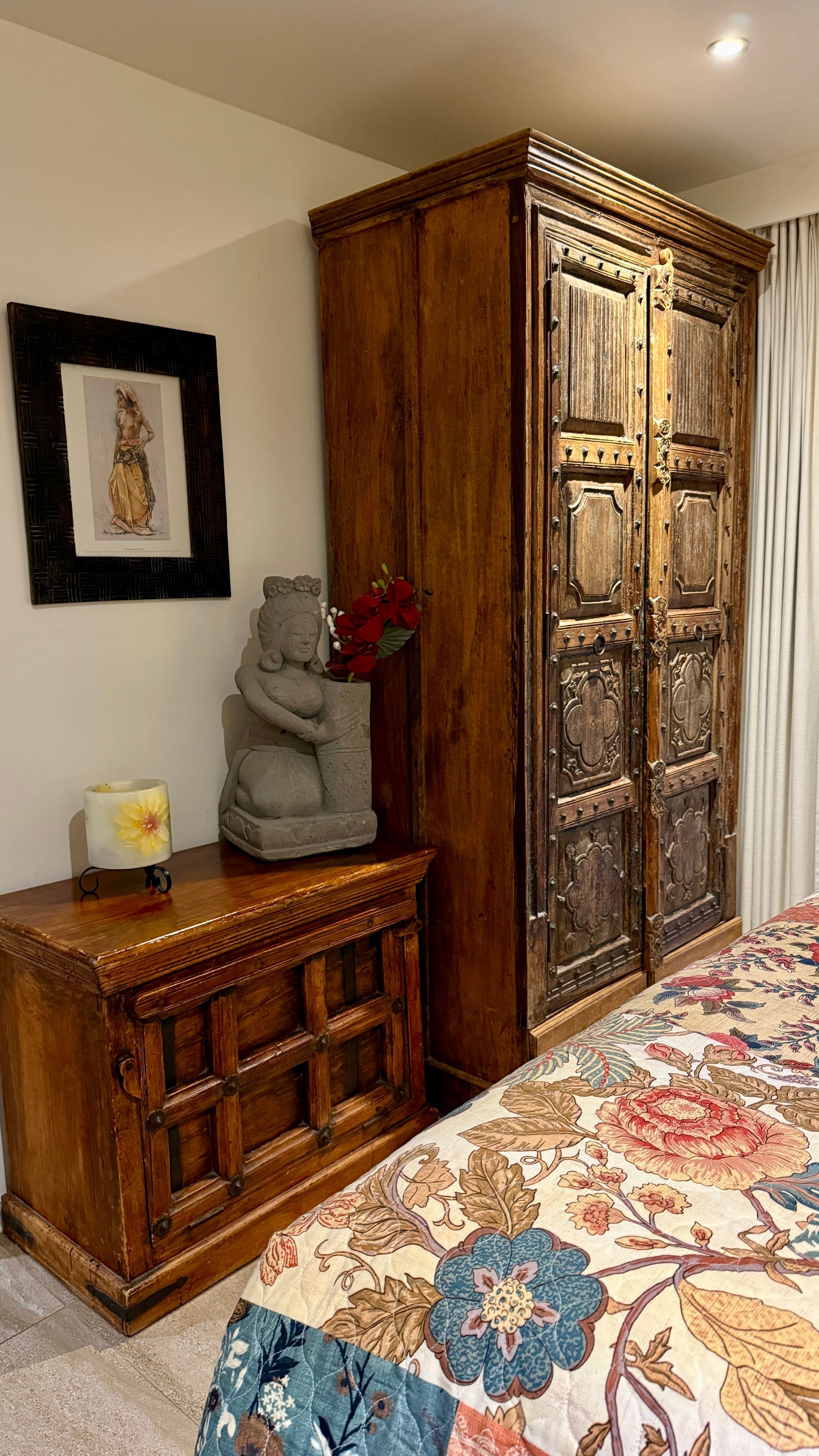 Bedroom with ornate wooden furniture, including a nightstand, wardrobe, and a bed — Bali at the Bay in Nelson Bay, NSW