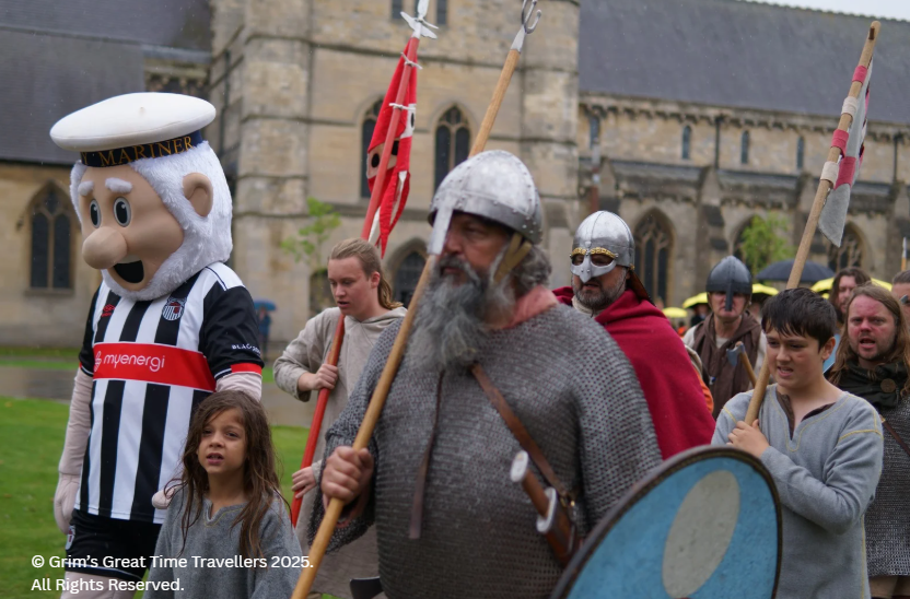 Grim the Viking and the Vikings march in Havelok parade with the Mighty Mariner