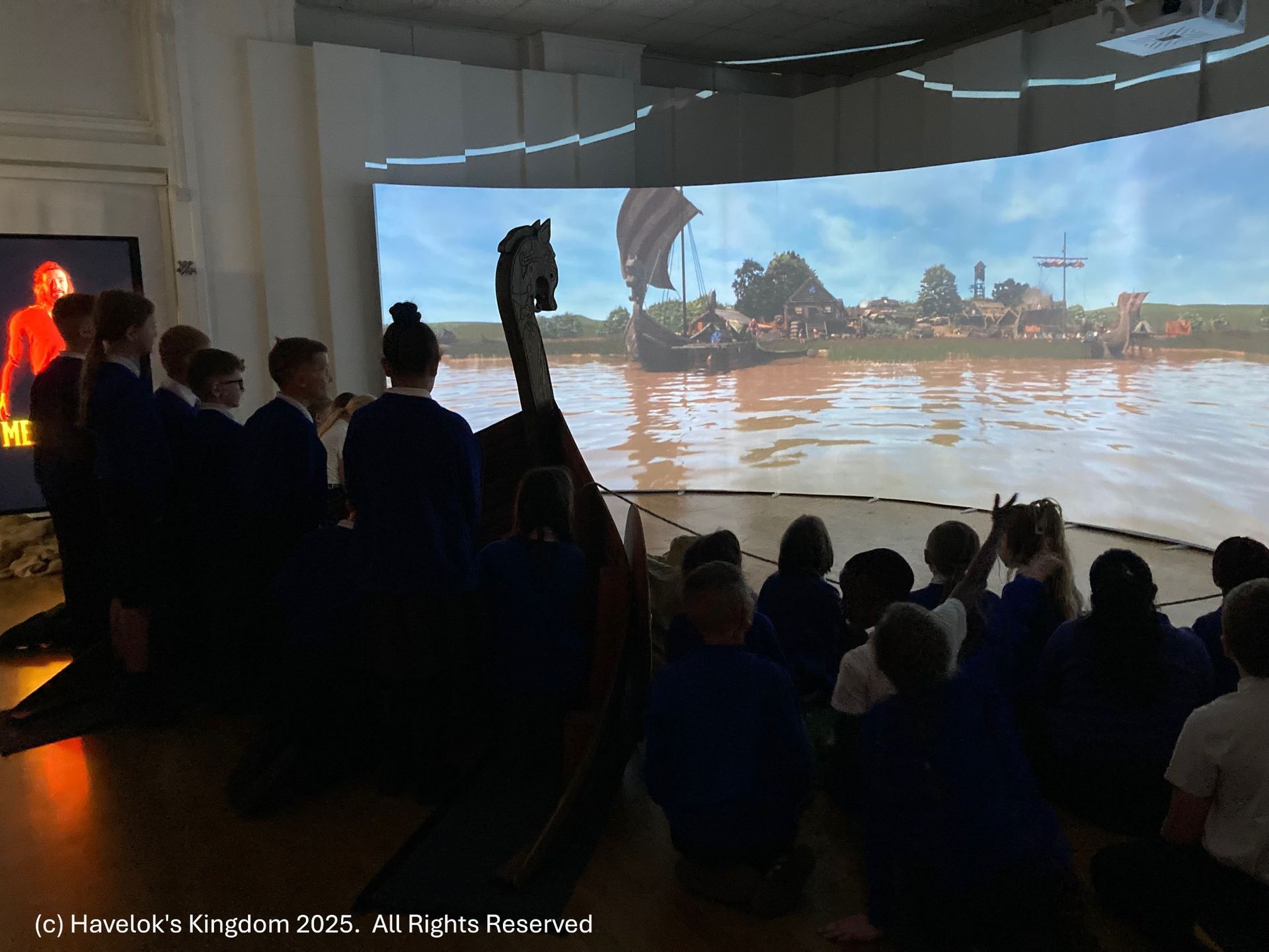 School children watching Havelok viking village ride 