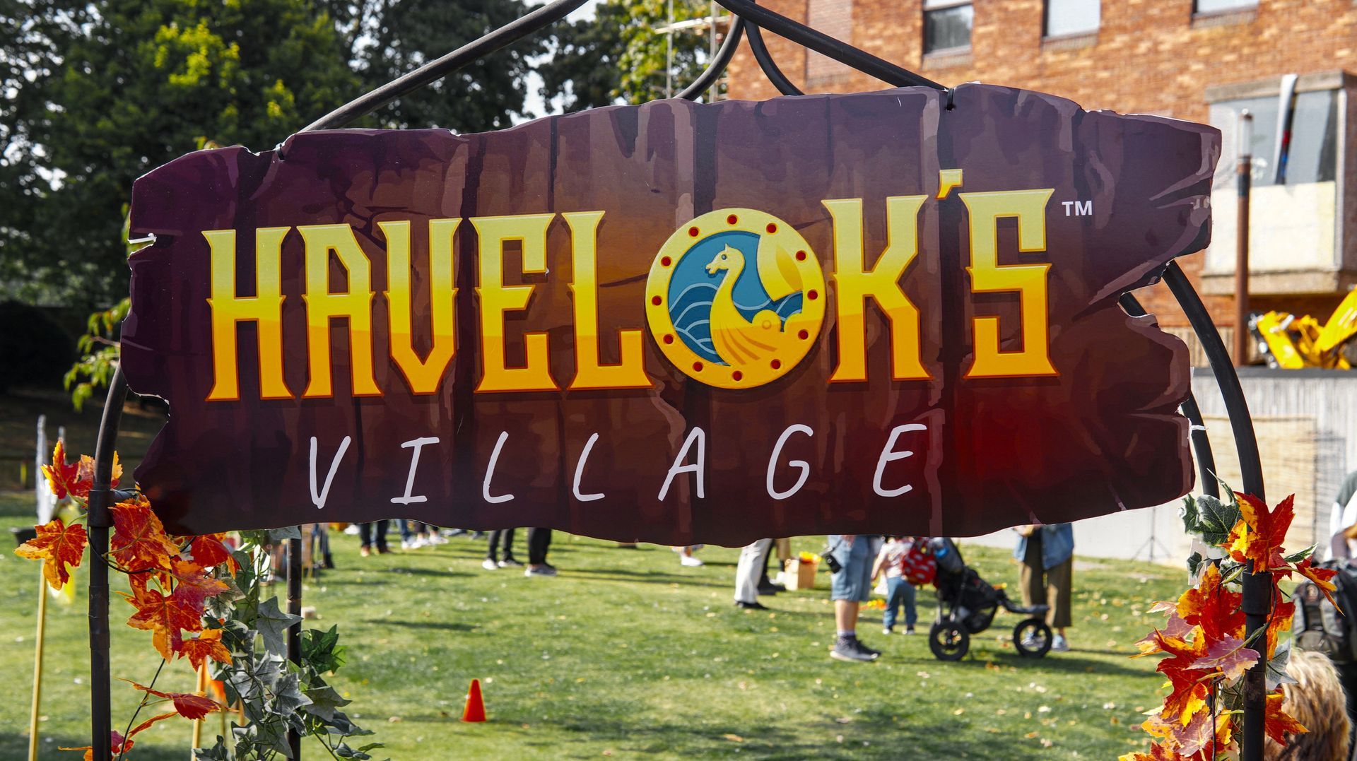 A sign that says havelok 's village on it