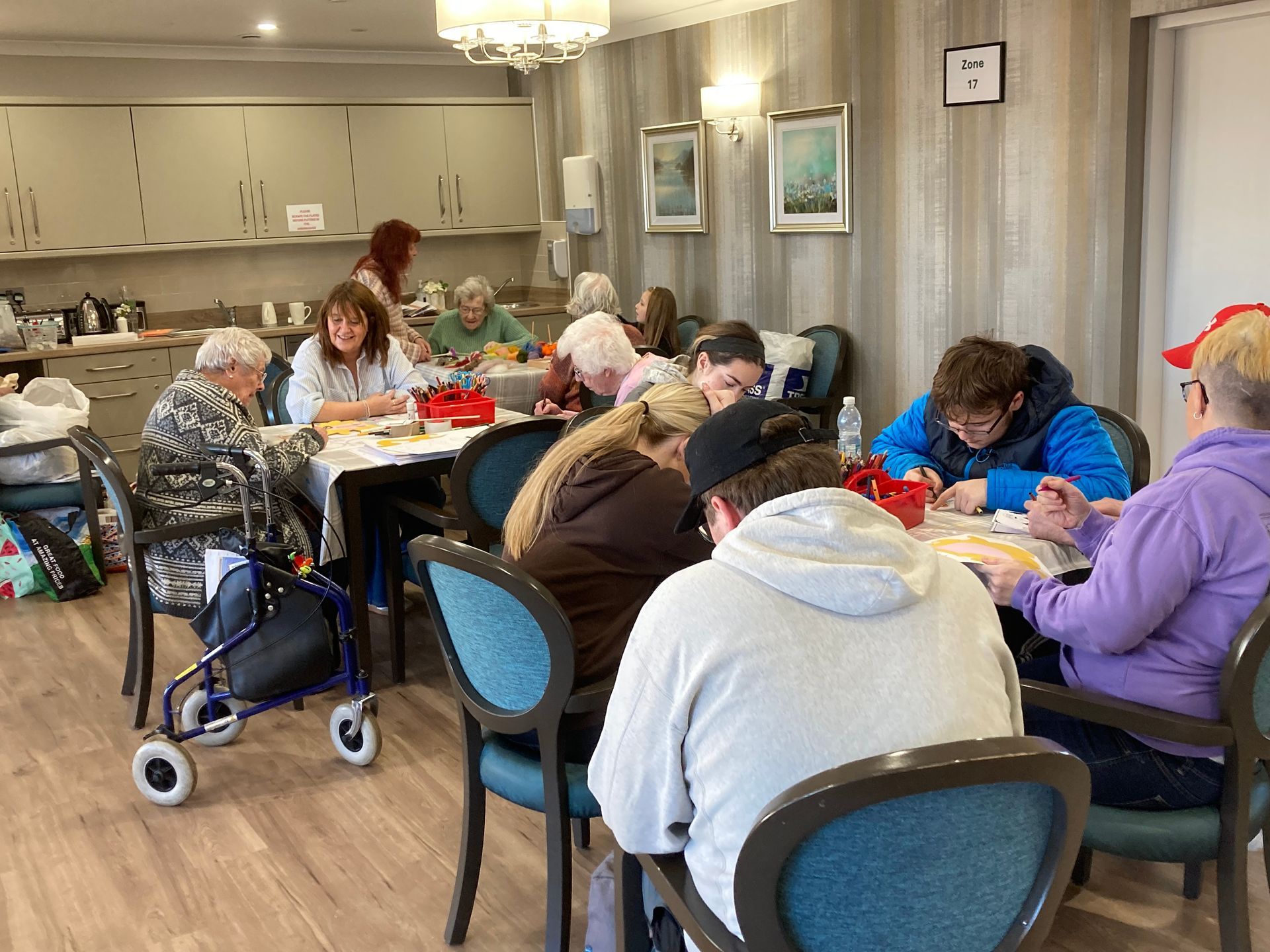 A group of people are sitting at tables in a room.