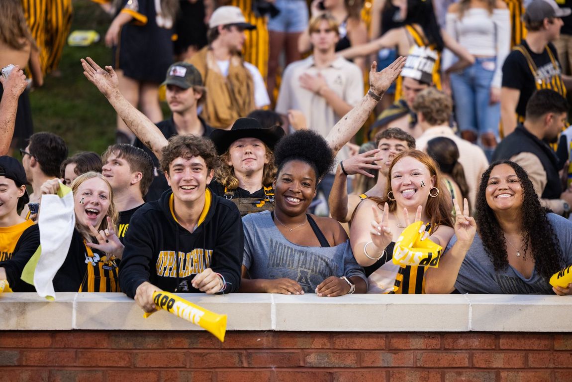 An Image of students in an audience at a sporting event