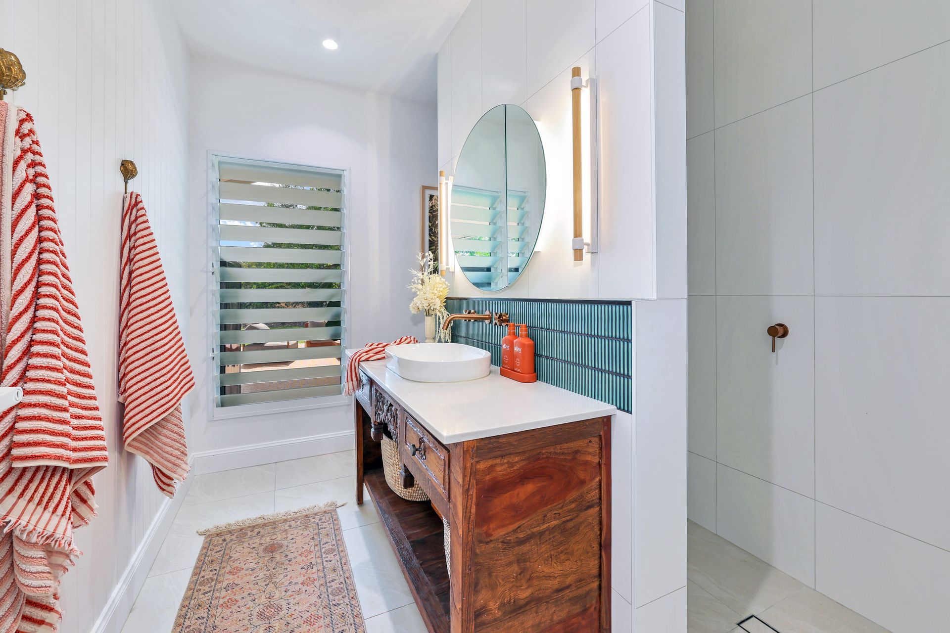 A Long Hallway With a Black Carpet and White Walls — New Home Builders in Yarrawonga, NT