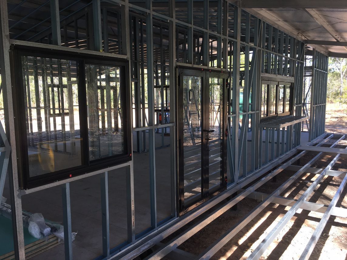 A building under construction with a lot of windows and doors — Local Builders in Yarrawonga, NT