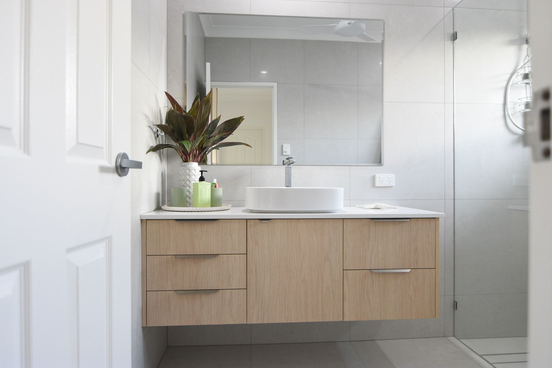 A Man is Standing in a Room With a Shovel — Local Builders in Yarrawonga, NT