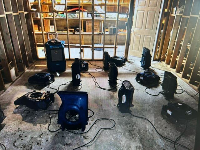 A room with a lot of electrical equipment on the floor