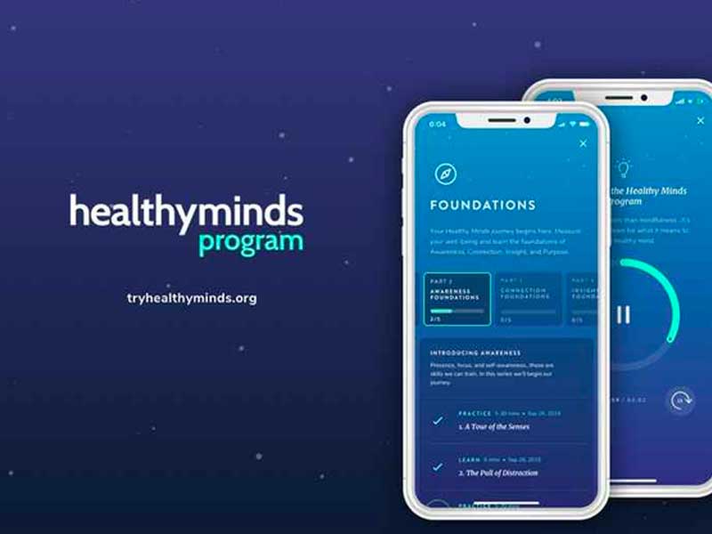 A phone with a healthyminds program app on it.