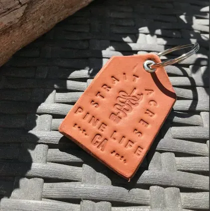 leather keychain that has strait acres embossed