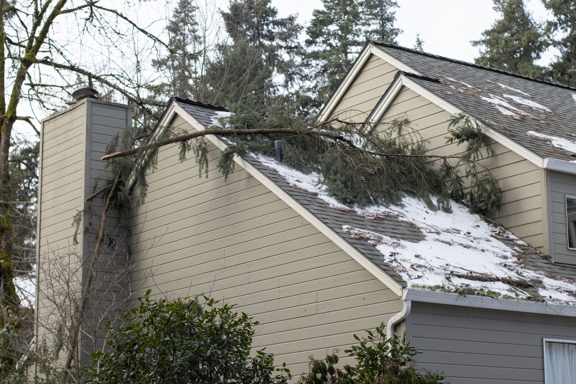 Winter storm damage on a roof