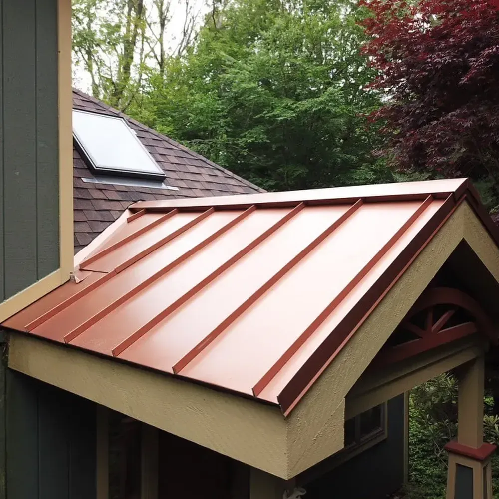 A house with a copper roof and a skylight