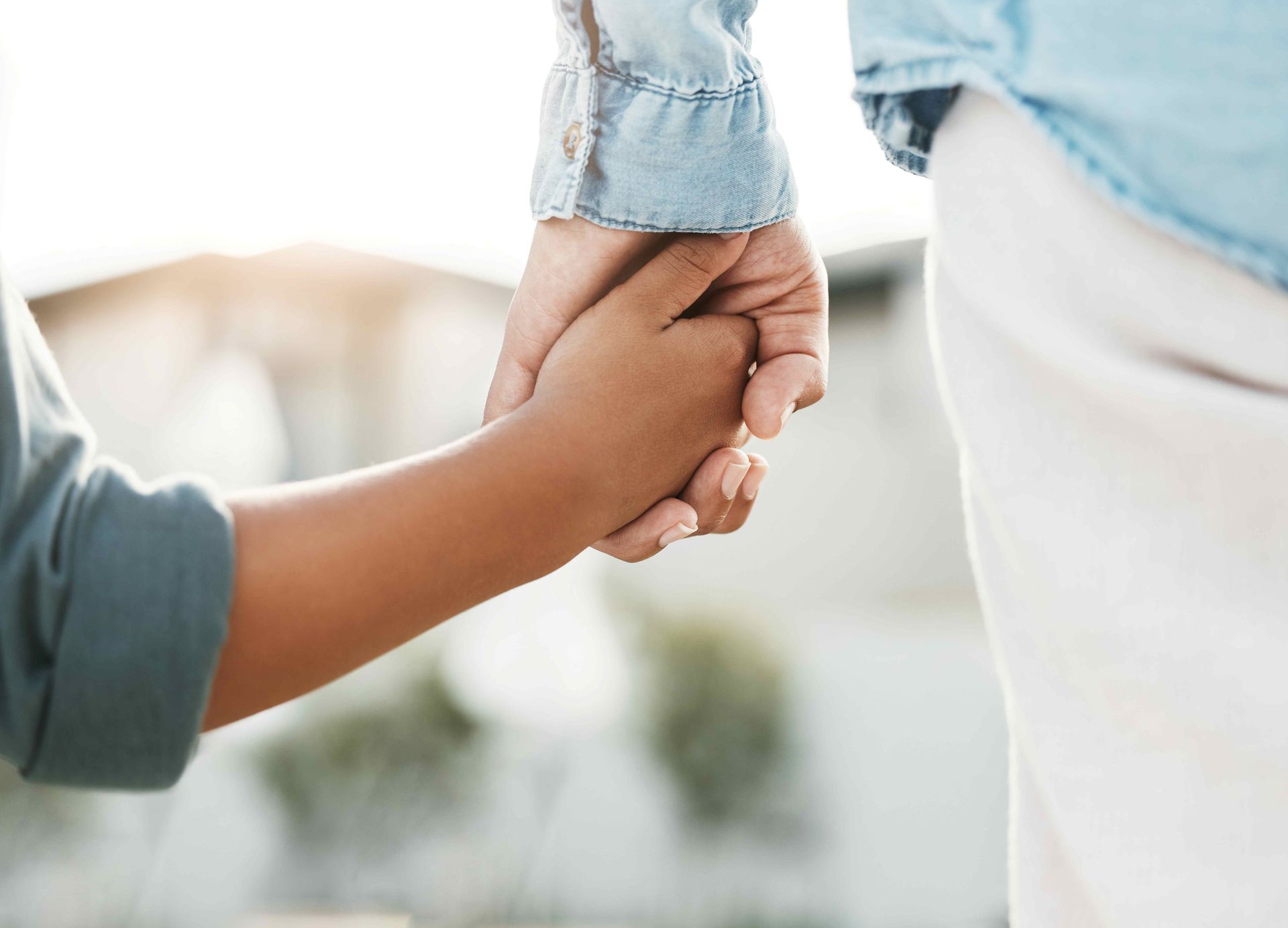 Parent holding child’s hand Parent holding child’s hand