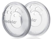 Two clear Medela breast pump shields with white rims, side by side