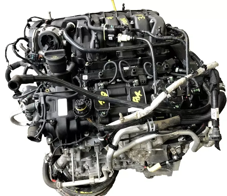 A close up of a car engine on a white background. A close up of a car engine on a white background.