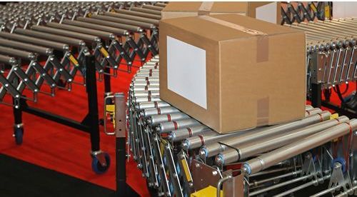 A box is sitting on top of a conveyor belt.