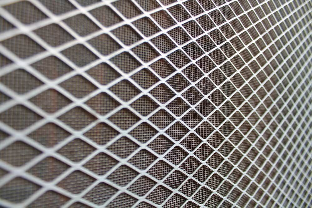 A Close Up of a Metal Mesh With Holes in It — Whitsunday Vogue Interiors in Cannonvale, QLD