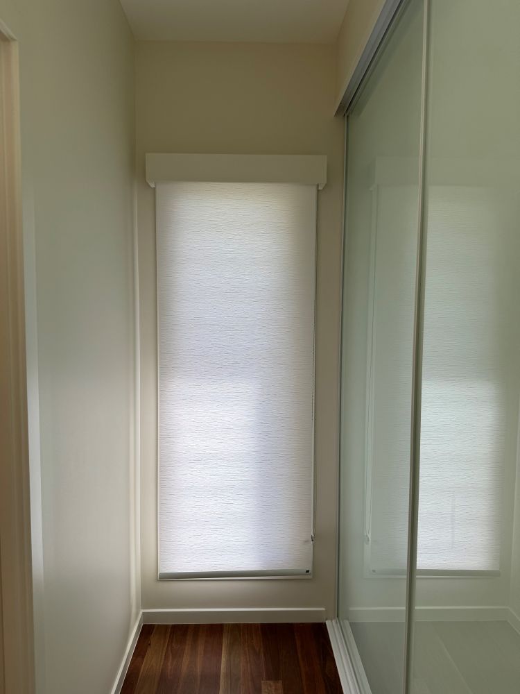 A Hallway With a Window and a Sliding Glass Door — Whitsunday Vogue Interiors in Cannonvale, QLD