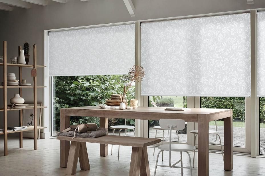 A Dining Room With a Table and Chairs and White Blinds — Whitsunday Vogue Interiors in Cannonvale, QLD