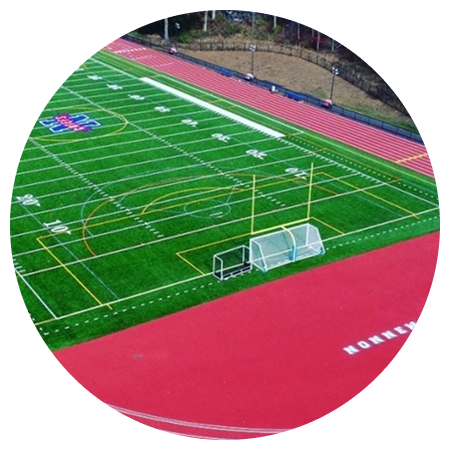 An aerial view of a football field with a running track.