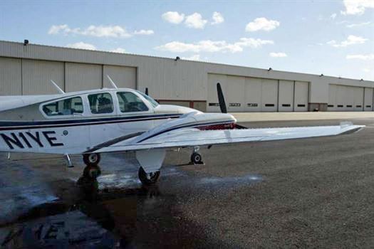 A small plane with the letters niye on the side of it