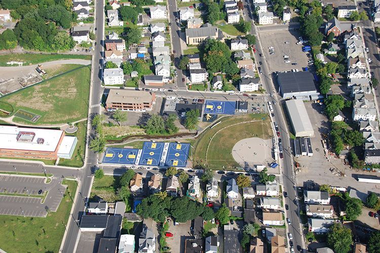 An aerial view of a residential area with a baseball field