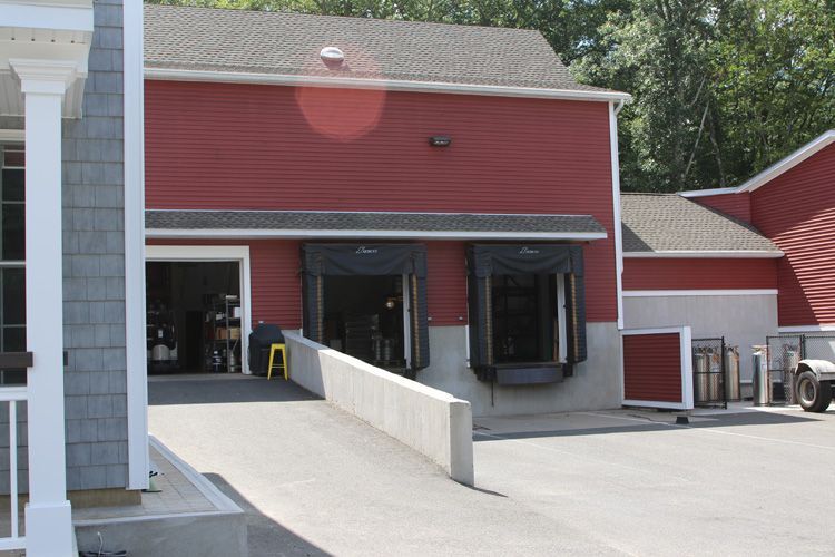 A red building with a ramp leading to it