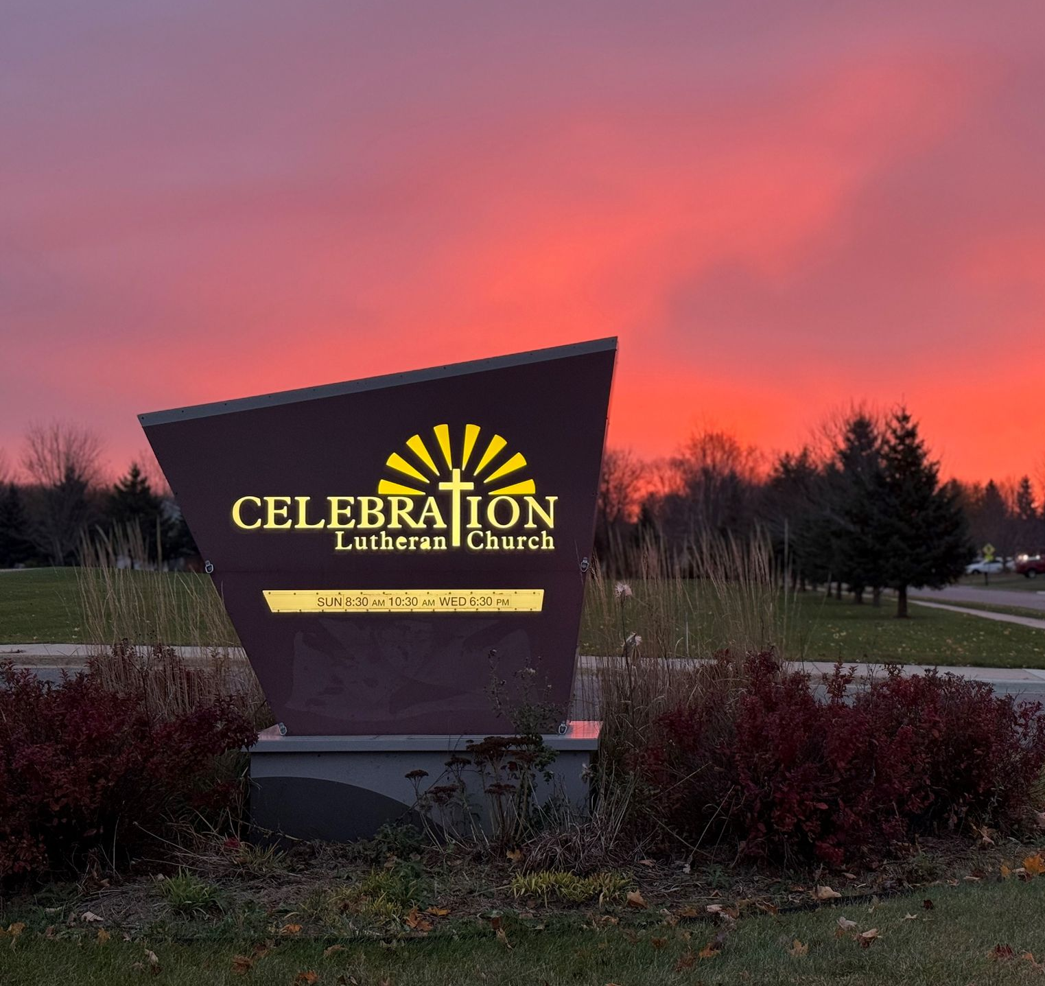 A large purple sign for celebration Lutheran church