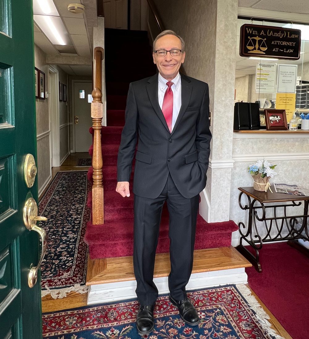 Attorney William Law Beside The Signage — Kingsport TN — William A. Law Attorney at Law Attorney William Law Beside The Signage — Kingsport TN — William A. Law Attorney at Law