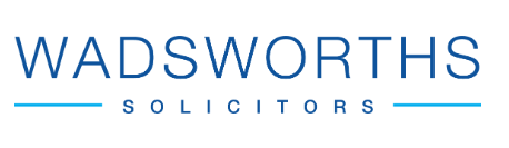 Wadsworths Solicitors logo with blue text and lines, white background.