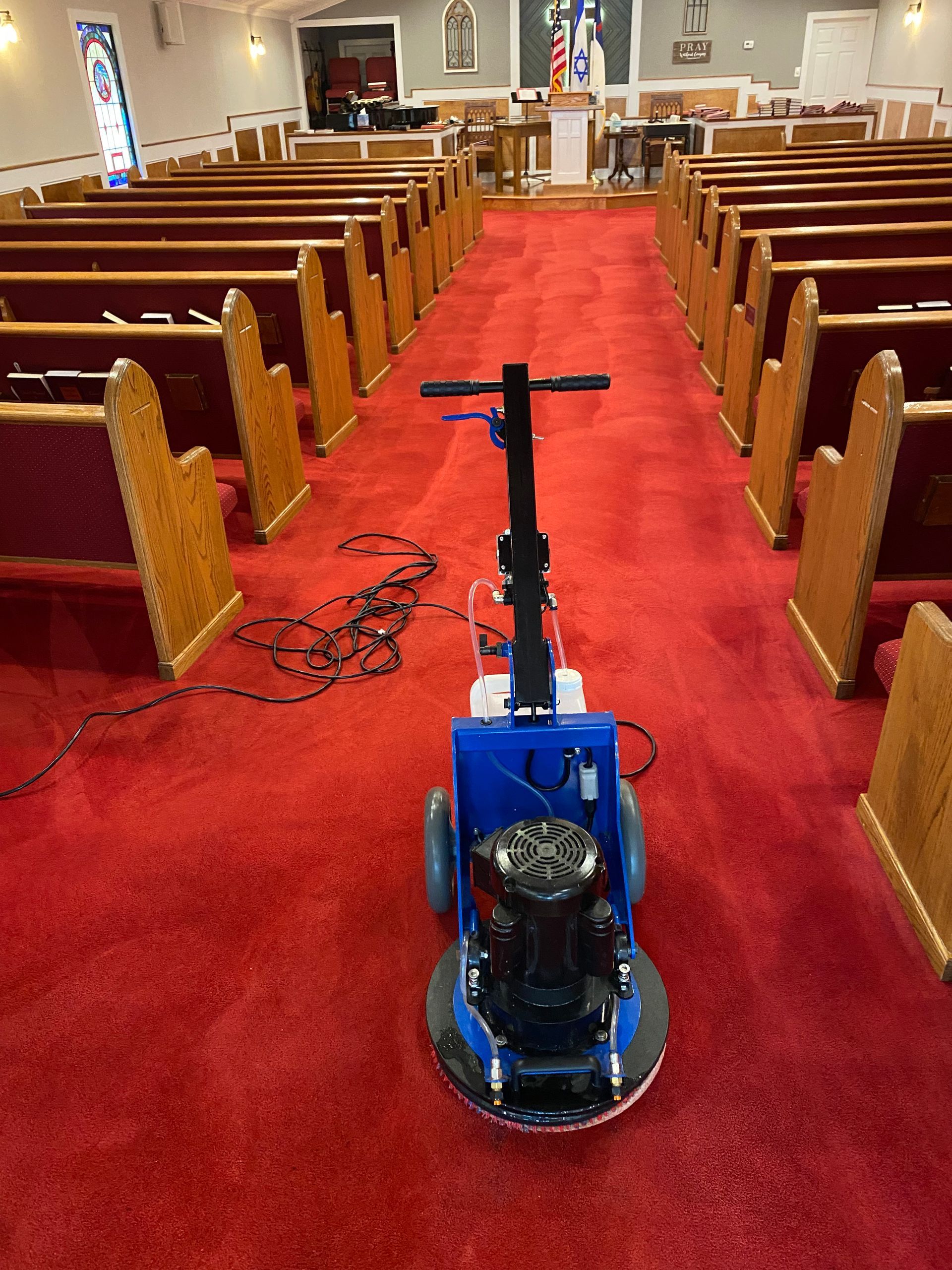 “VeriClean Carpet Cleaning performing commercial carpet cleaning in a church sanctuary using low-moisture 