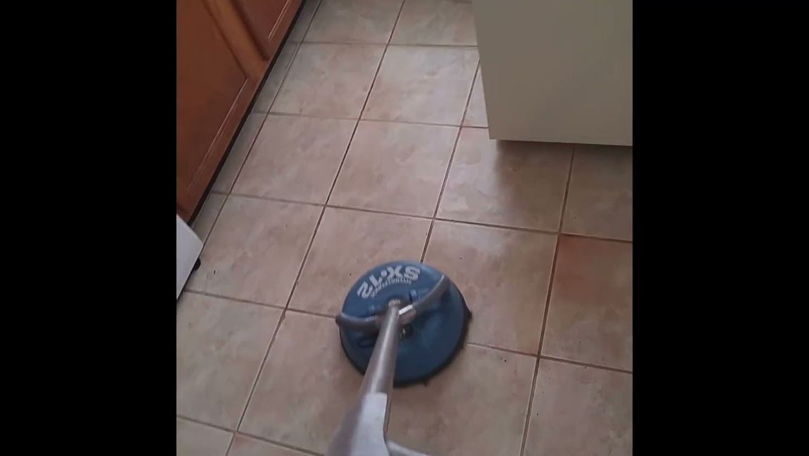 Tile and grout cleaning service restoring kitchen floor in Smyrna, GA