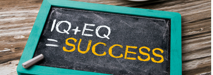 A chalkboard with the words `` iq + eq = success '' written on it.
