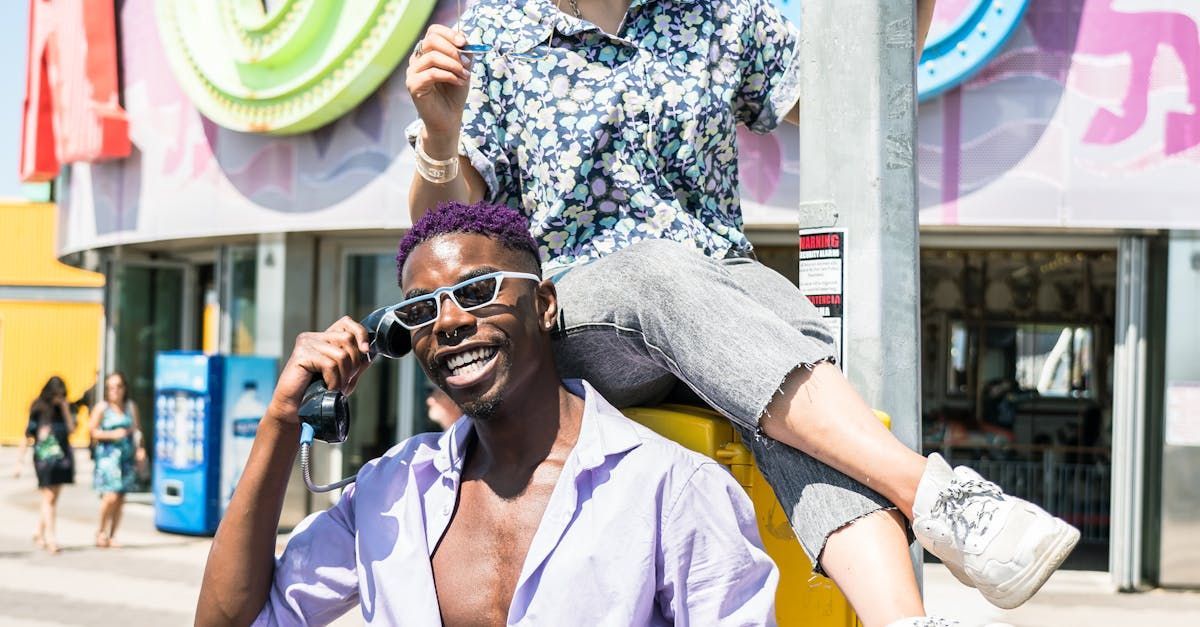 A man is carrying a woman on his shoulders.