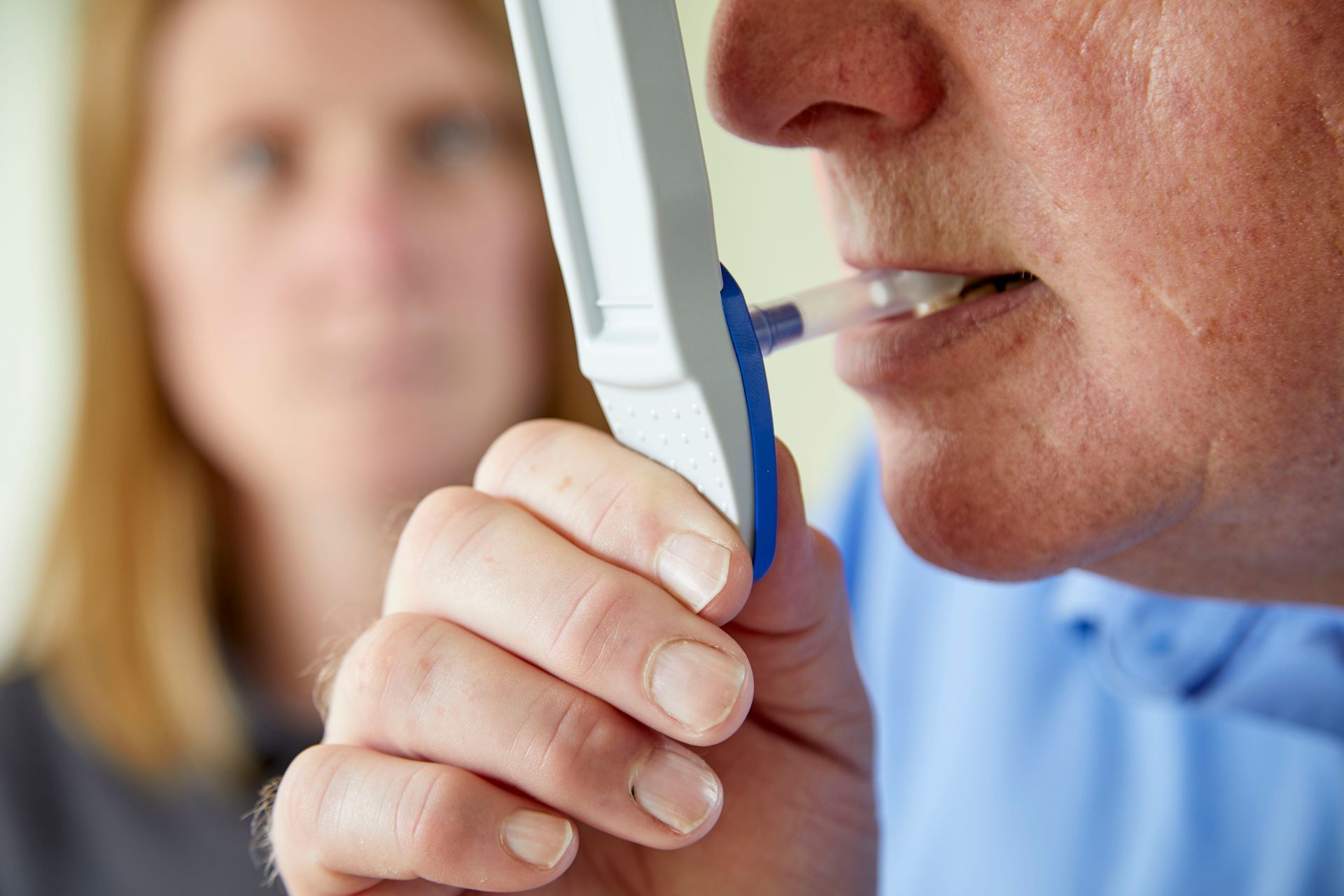 Oral fluid drug testing kit being administered by a trained technician in a workplace setting