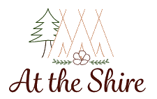 Logo: Teepees, pine tree, flower, and 