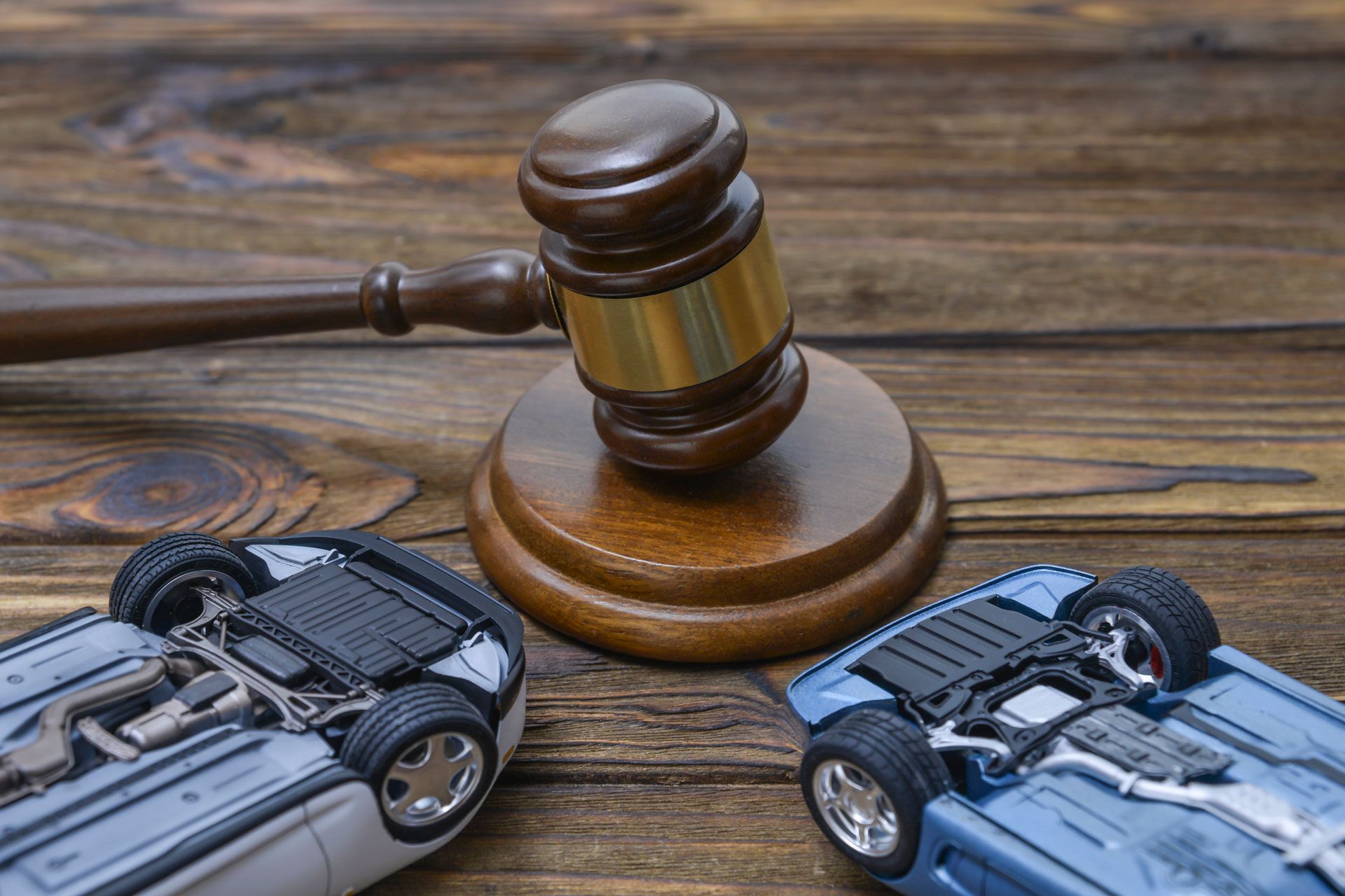 Two collapsed inverted cars symbolizing auto accident lawyer services in Phoenix, AZ by Ely, Bettini