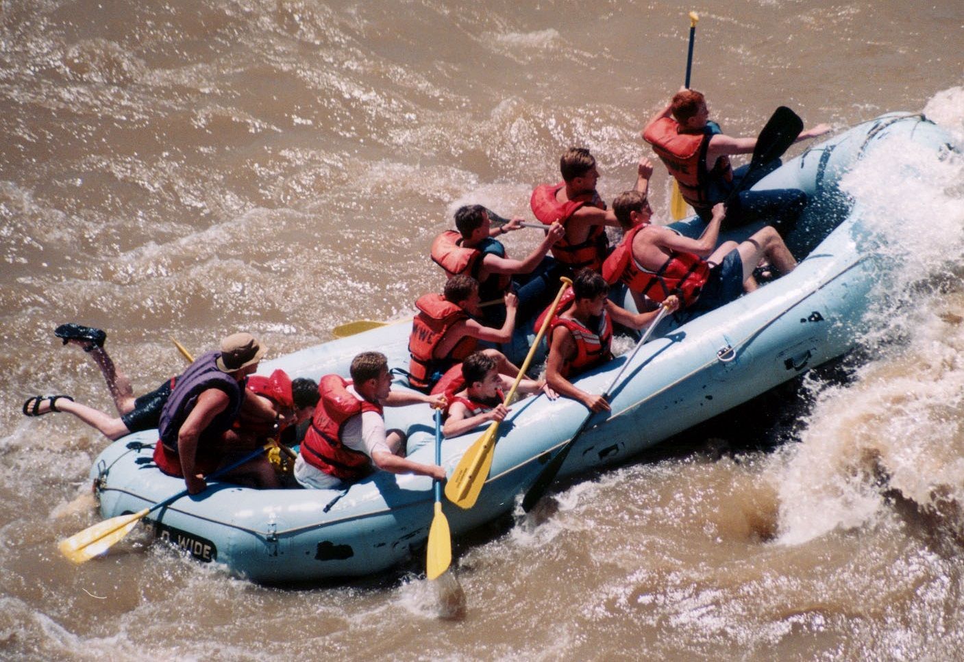 A group of people are rafting down a river