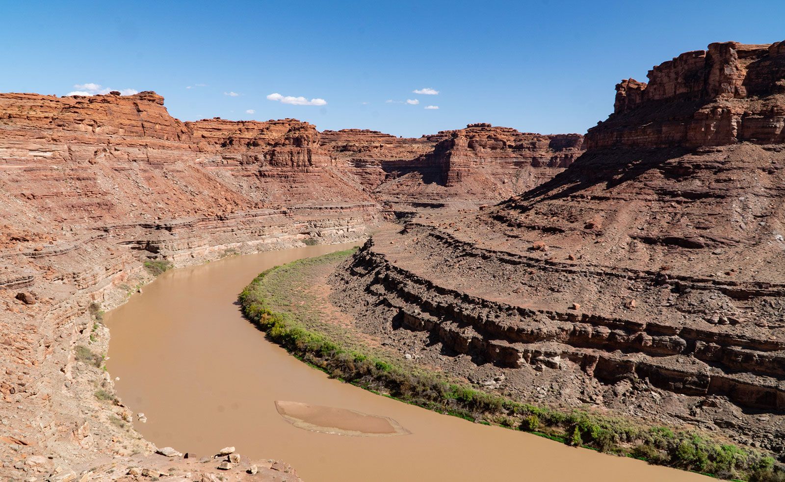 A river in the middle of a canyon surrounded by rocks
