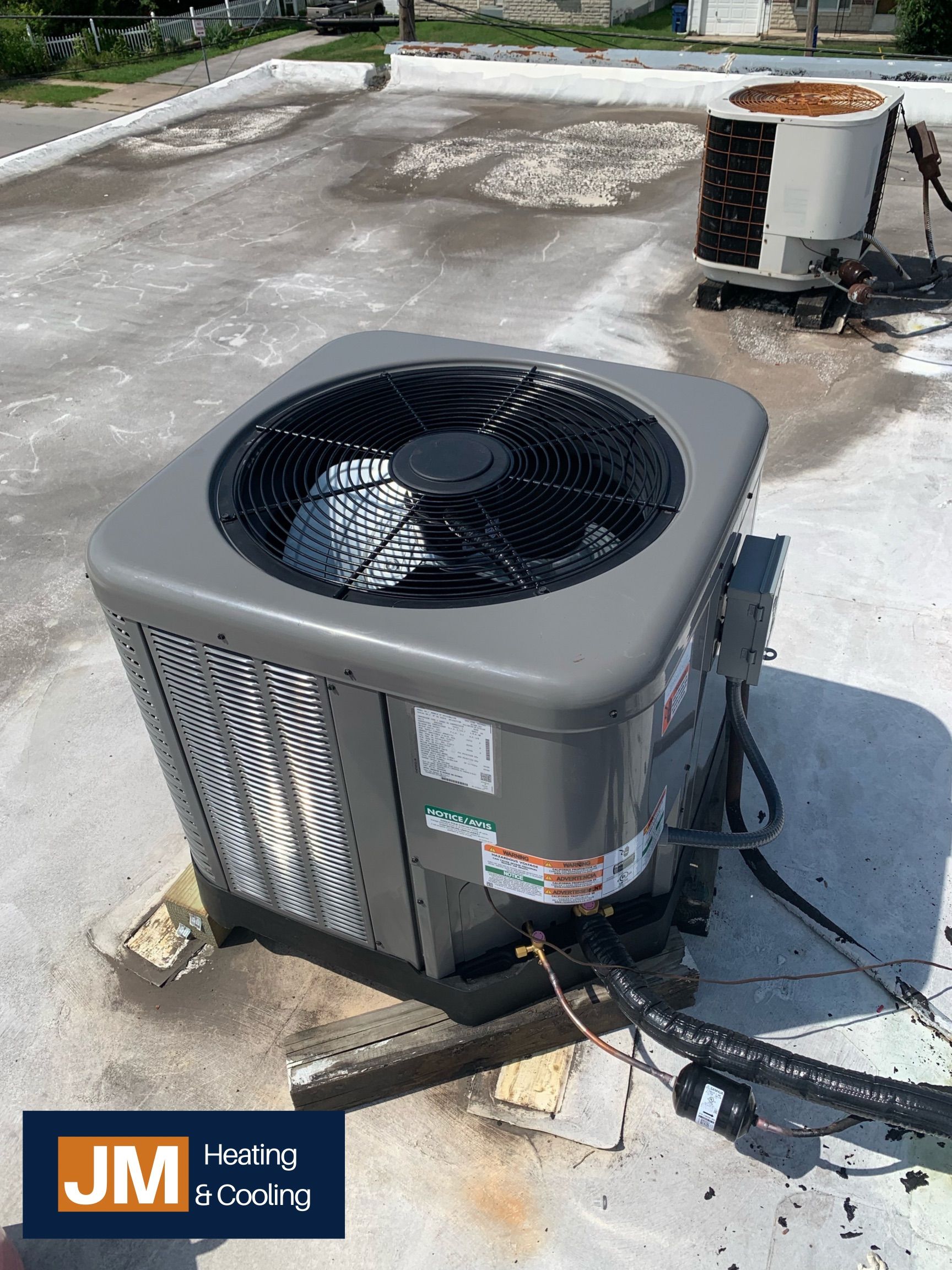 Air Conditioner Being Fixed — Springfield, MO — JM Heating & Cooling Air Conditioner Being Fixed — Springfield, MO — JM Heating & Cooling