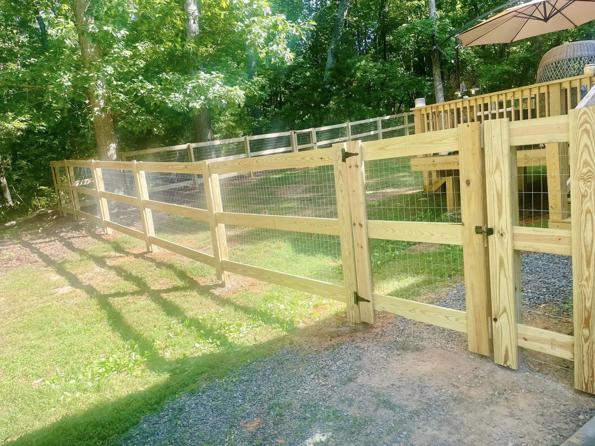 wood fencing with wire fence behind