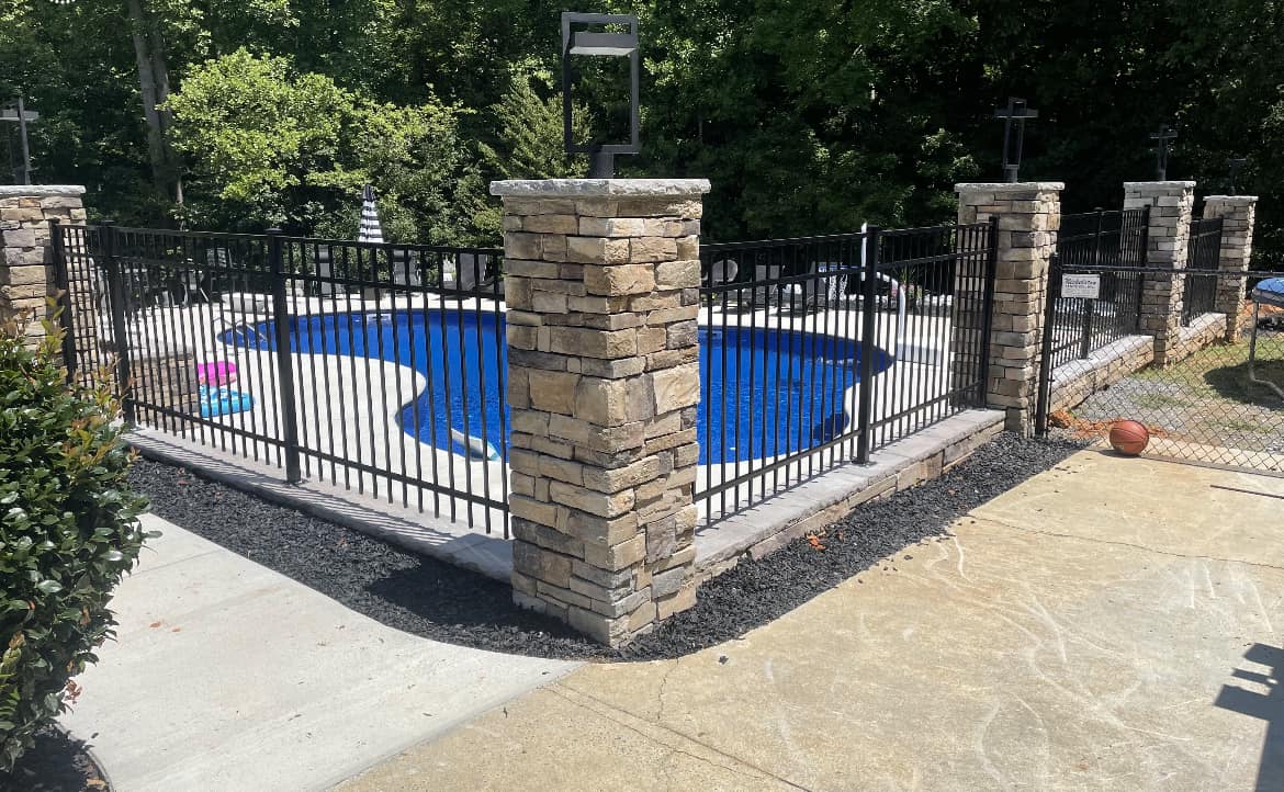 Aluminum fencing around inground swimming pool
