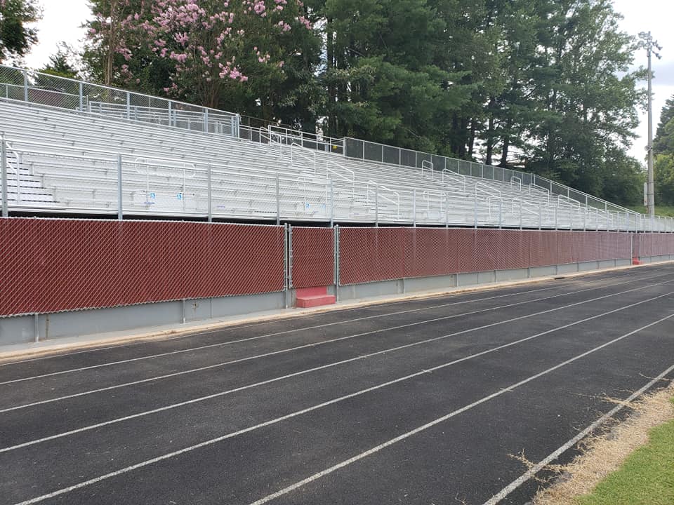 running track with chain link fence