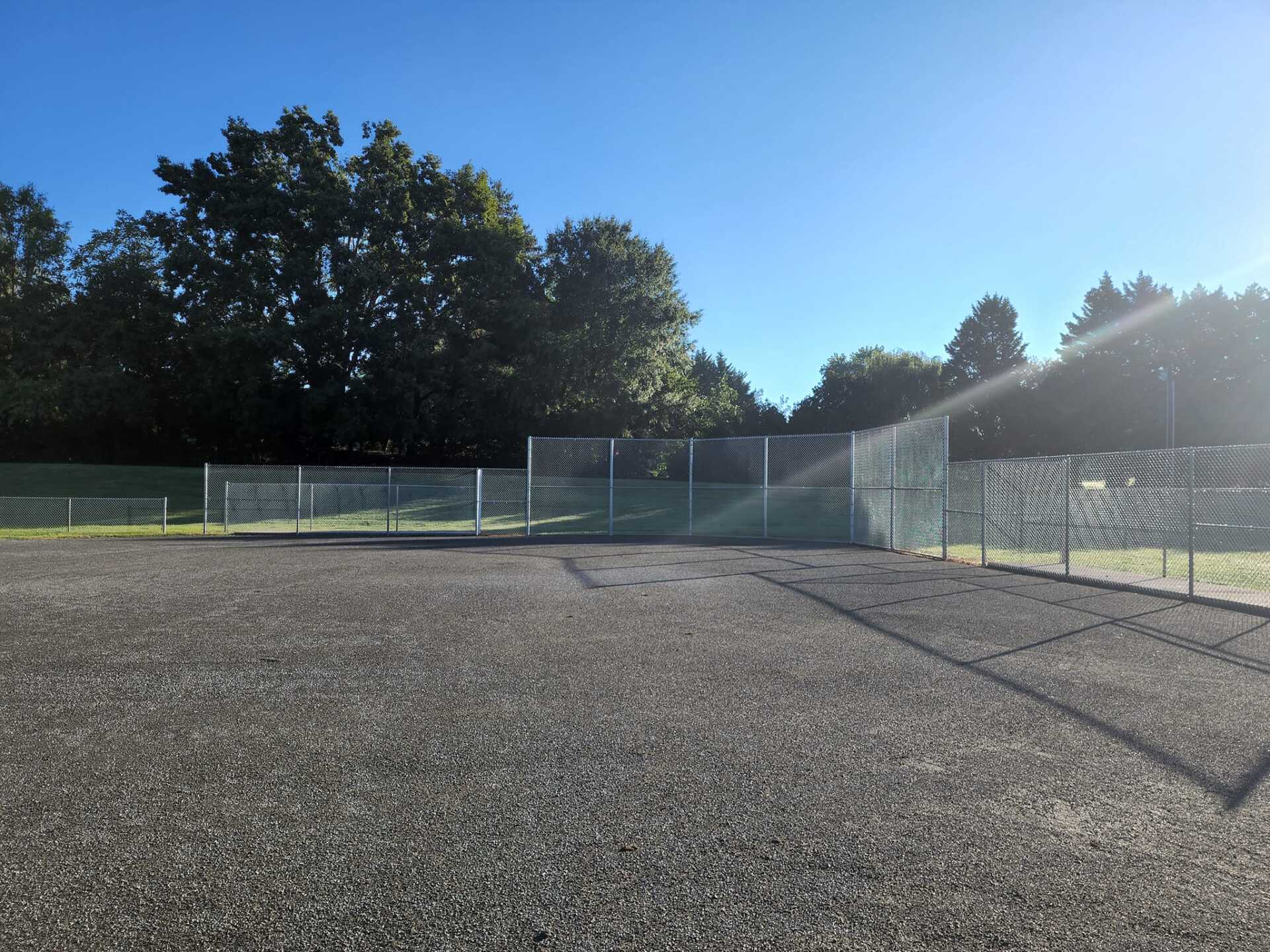 chain link fence enclosing park area