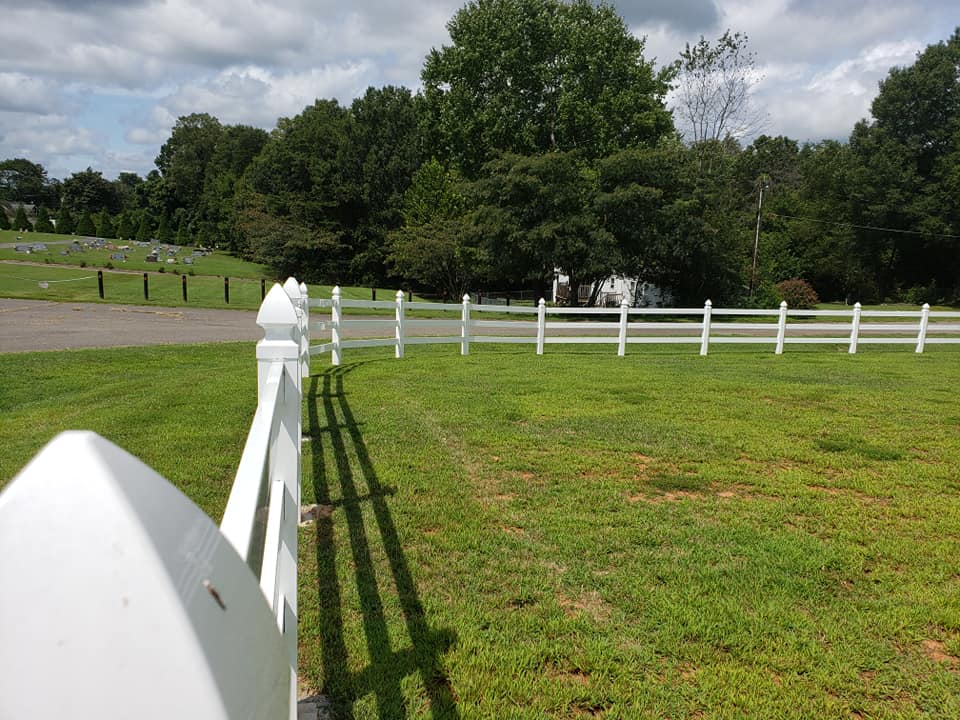 vinyl picket fencing along street