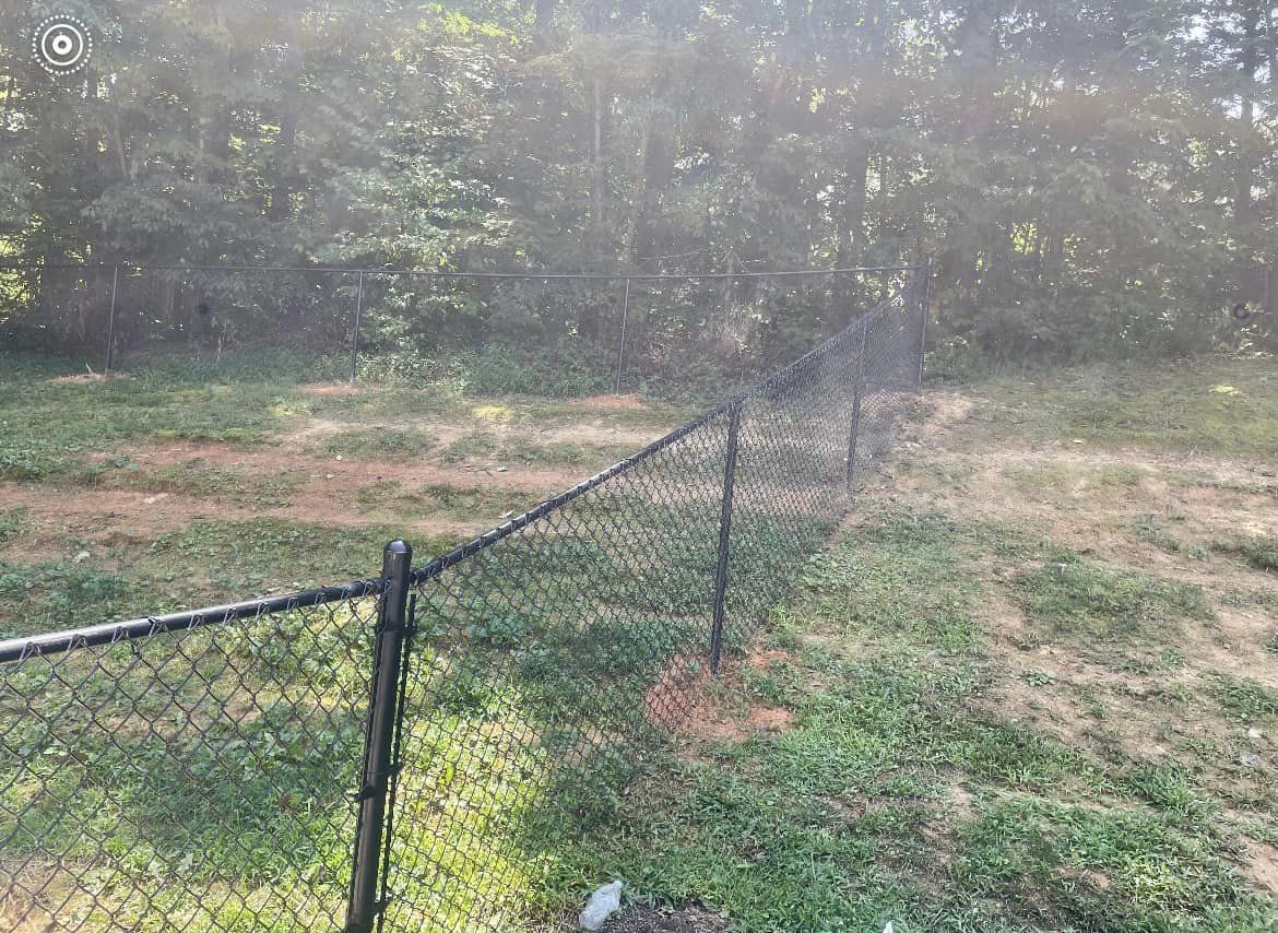 Black vinyl chain link fencing surrounding property