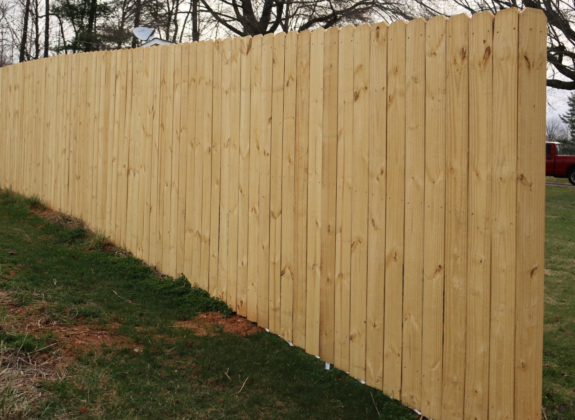 tall wooden fence along property