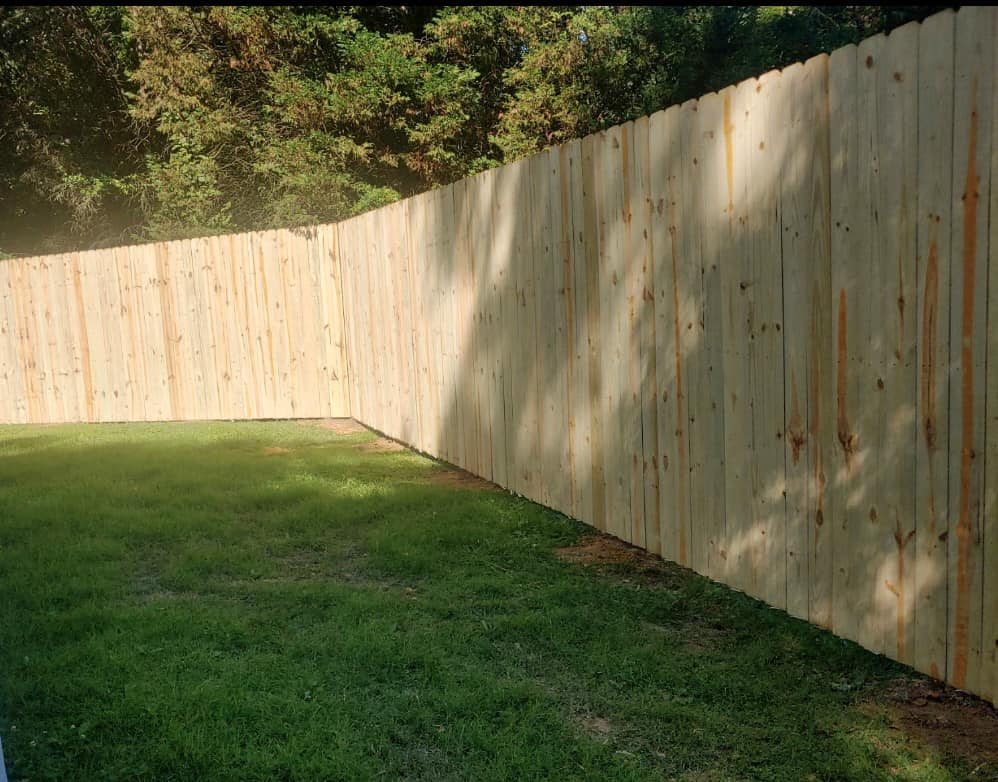 new, tall wooden fence