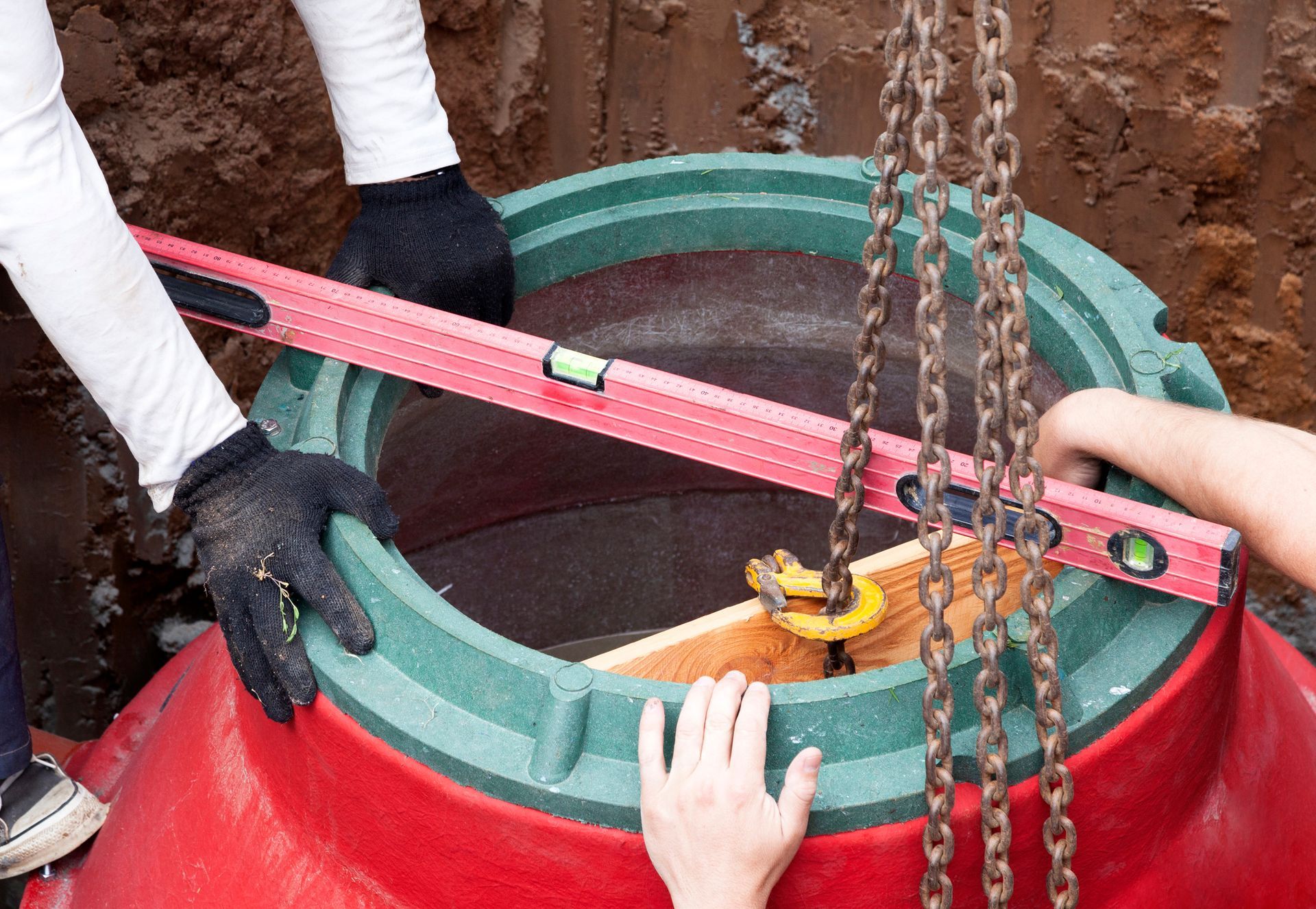 Leveling Manhole — Ray Township, MI — Allemon Septic Service Inc. Leveling Manhole — Ray Township, MI — Allemon Septic Service Inc.