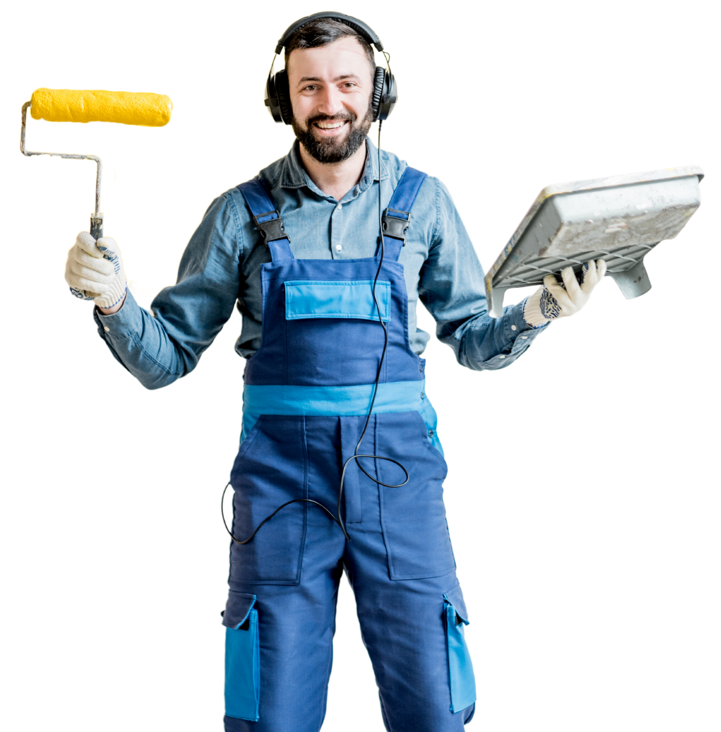 A man wearing headphones is holding a paint roller and a computer monitor
