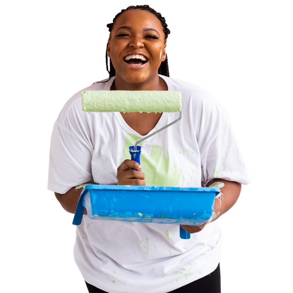 A woman is holding a paint roller and a paint tray