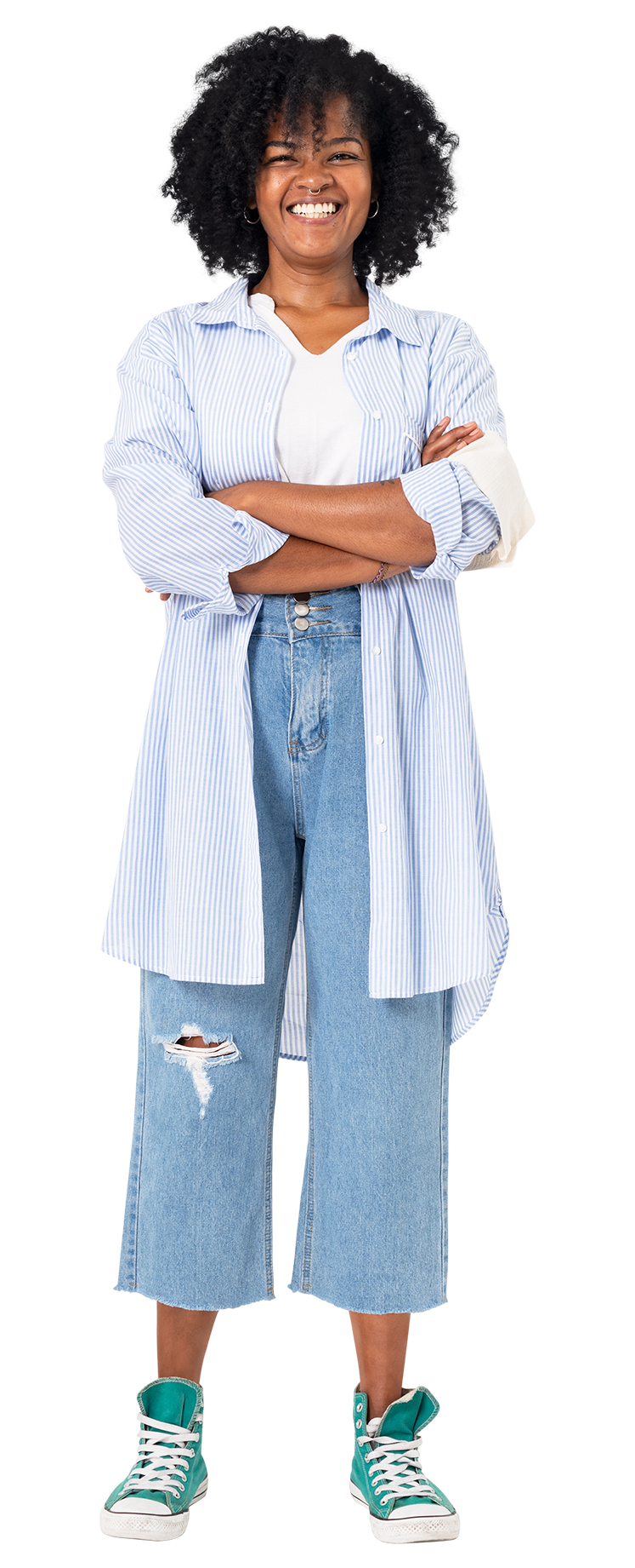 A woman is standing with her arms crossed and smiling.
